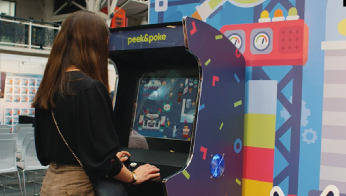 Woman Playing our Arcade Cabinet