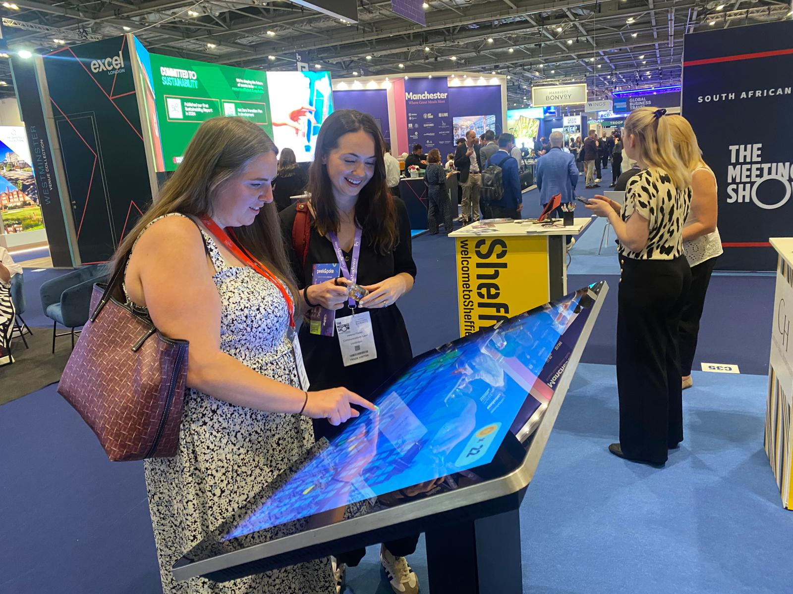 People Playing Large Touchscreen Game at Event
