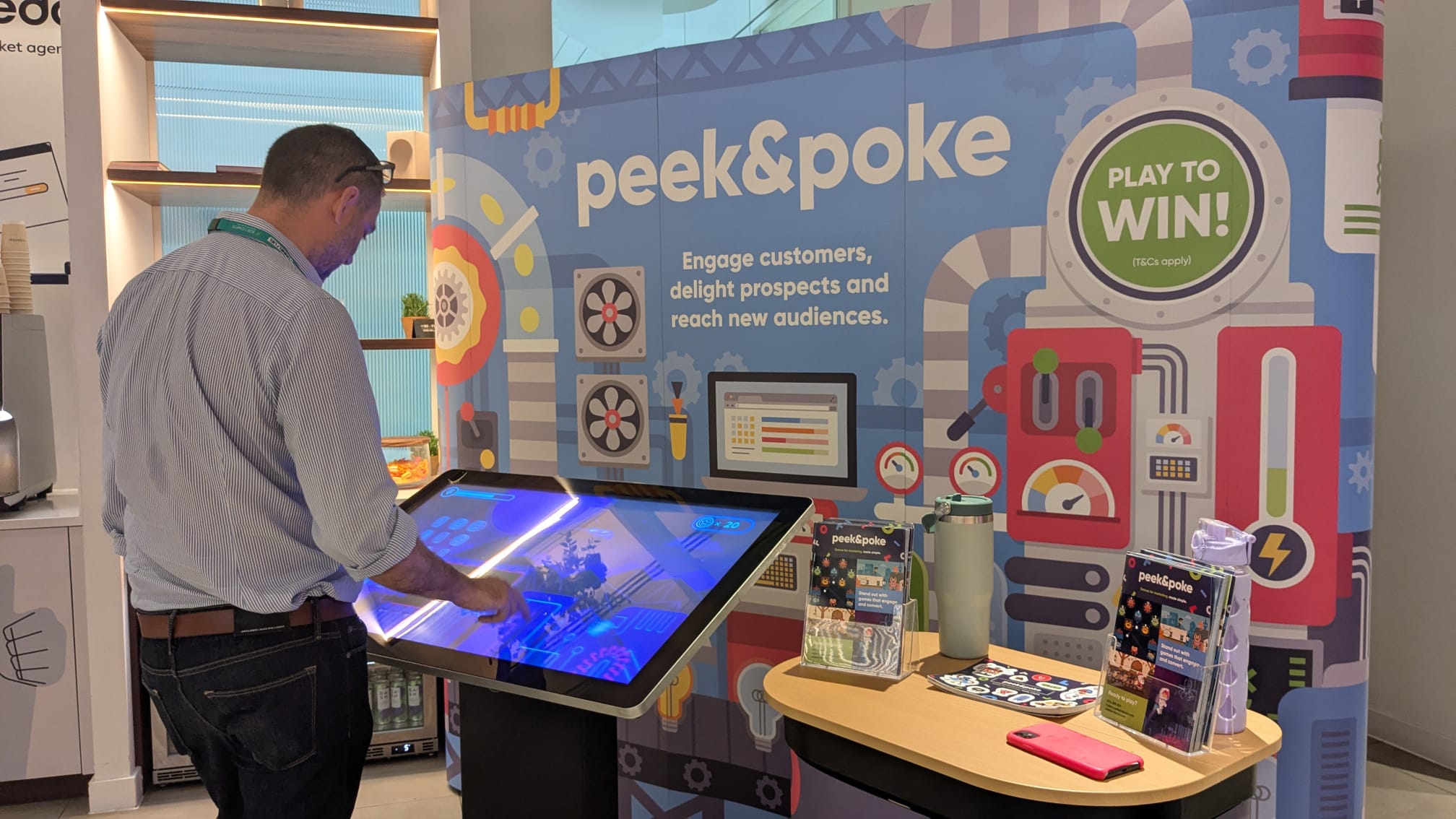 Man Playing Game on Touchscreen at Trade Show Stand